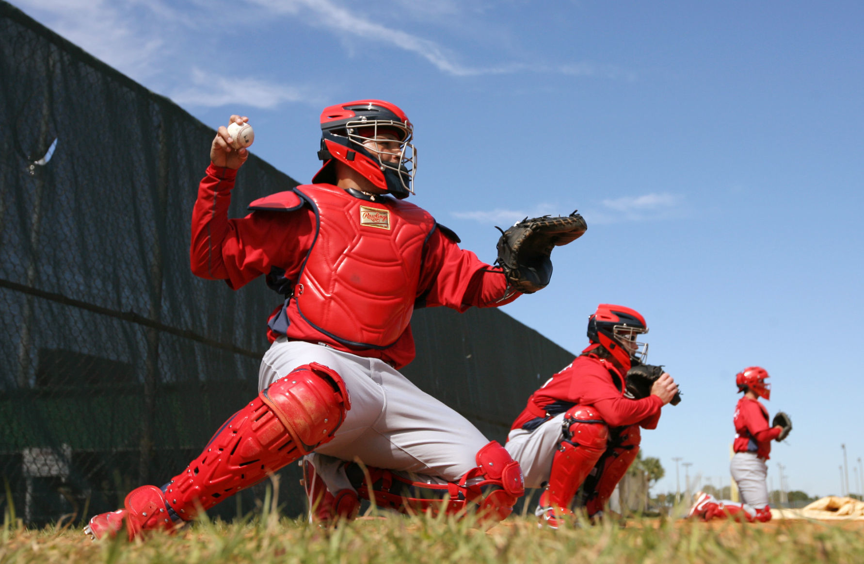 Yadier Molina takes a throw in spring training